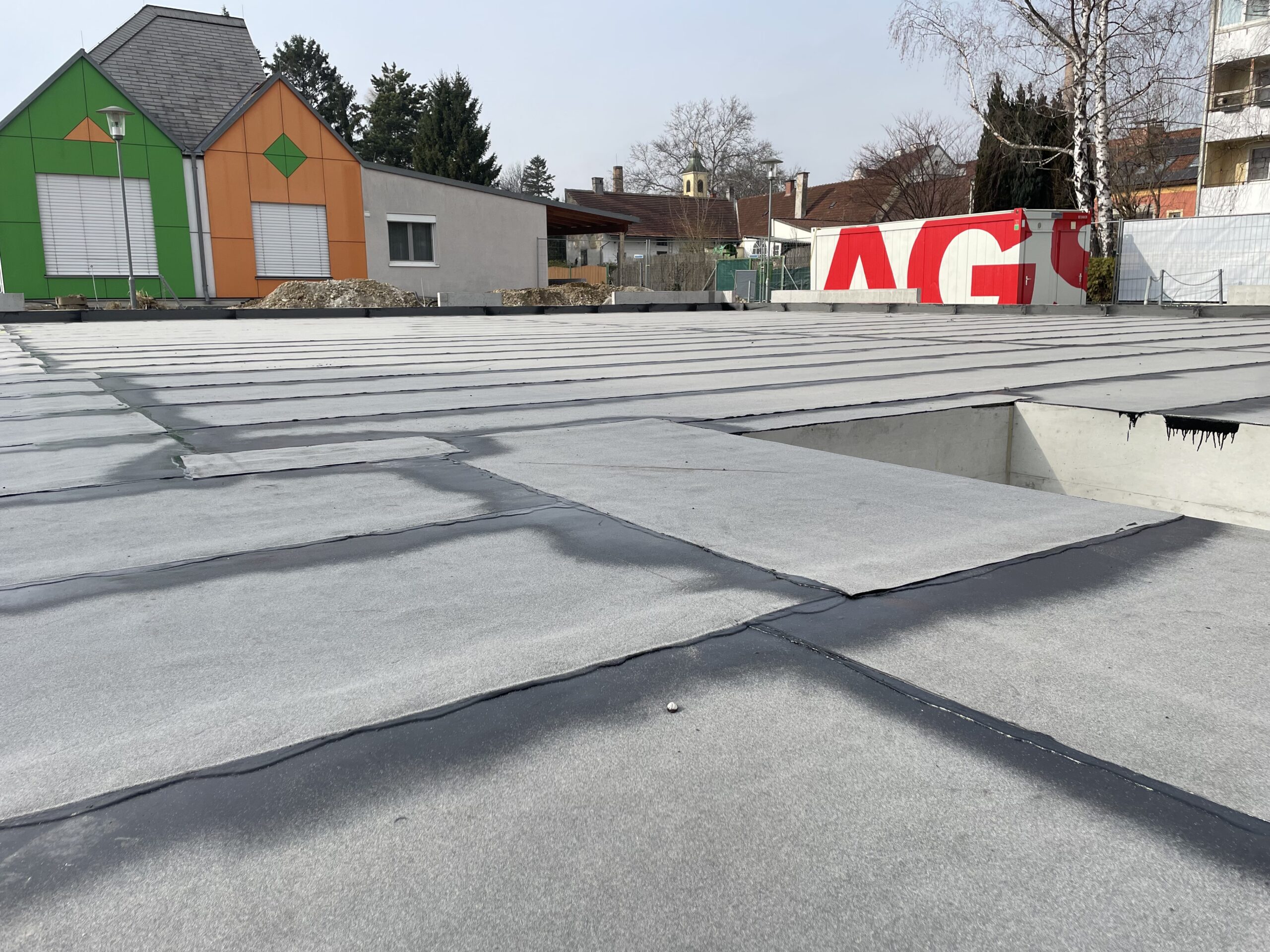 Flat roof with construction materials visible